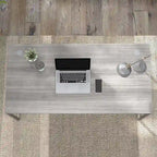Bureau informatique avec pieds en métal et gestion des câbles