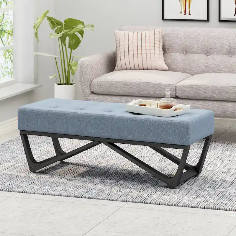 Banc-ottoman en tissu capitonné avec pieds en bois courbé