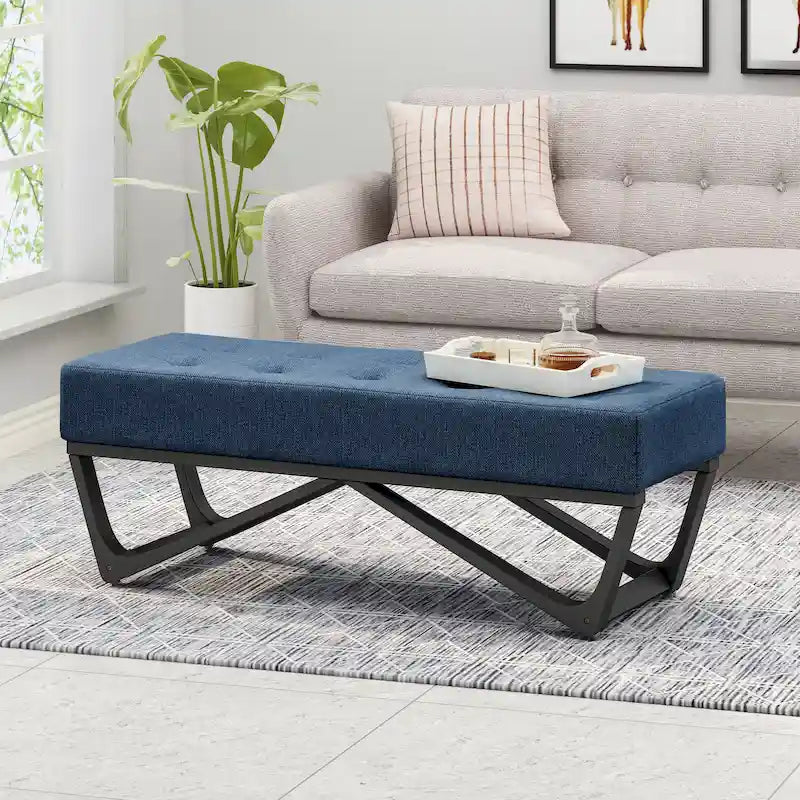 Banc-ottoman en tissu capitonné avec pieds en bois courbé