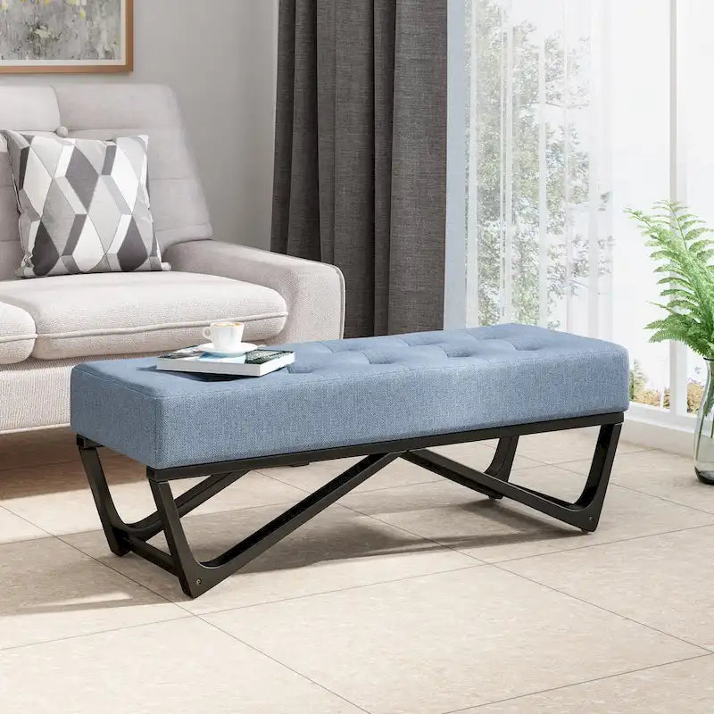 Banc-ottoman en tissu capitonné avec pieds en bois courbé