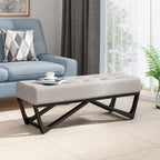 Banc-ottoman en tissu capitonné avec pieds en bois courbé