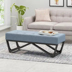 Banc-ottoman en tissu capitonné avec pieds en bois courbé