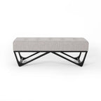 Banc-ottoman en tissu capitonné avec pieds en bois courbé