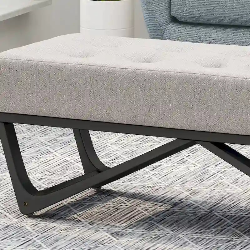 Banc-ottoman en tissu capitonné avec pieds en bois courbé
