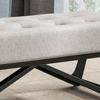 Banc-ottoman en tissu capitonné avec pieds en bois courbé