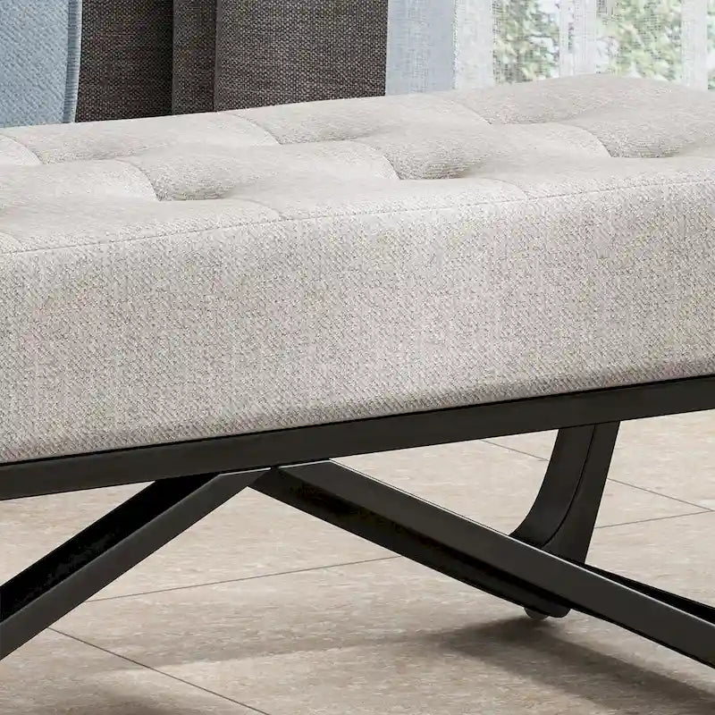 Banc-ottoman en tissu capitonné avec pieds en bois courbé