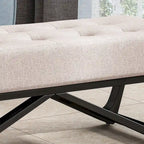 Banc-ottoman en tissu capitonné avec pieds en bois courbé